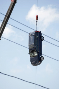 For the second day in a row, on Wednesday, September 28, 2011, a car is suspended above a simulated tunnel on the Raynham Park set of the movie "R.I.P.D." (Emily J. Reynolds/The Enterprise)  