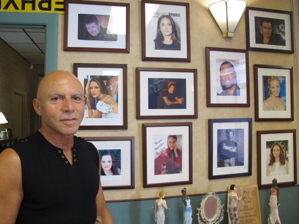 Farshad Sayan, a dry cleaner who owns Clevergreen Cleaners, has been working on movie wardrobes with Virginia Johnson for the last seven years. (Andrea Shea/WBUR)