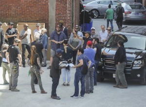 (AMANDA SABGA/ Staff photo) The crew gathers for filming of "Proud Mary" in Lawrence Tuesday.