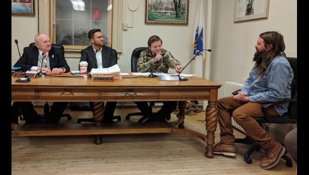 Alex Berard, assistant location manager for Olive Avenue Productions, gave an update to the selectboard Wednesday on the end of "Castle Rock" filming in town. Berard reported that there are still two more days of filming left, slated for Tuesday, Dec. 19 and Wednesday, Dec. 20, weather permitting. Left to right -- Selectmen James Cornwell, Ryan Mailloux, and Richard Sheridan; and Berard. Photo by Jared Robinson